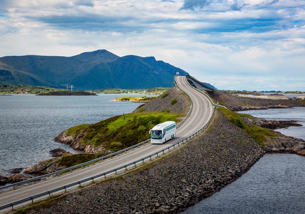 Tourist bus traveling on the road in Norway